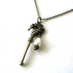 Bronze Seahorse With White Teardrop Pearl Necklace..